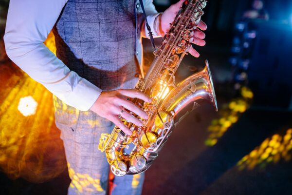 A Close-Up Shot of a Man Playing a Saxophone